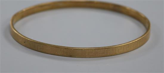 A 9ct gold plated metal core bangle.